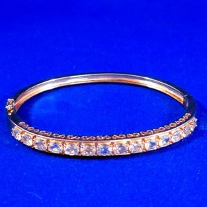 BEAUTIFUL ROSE GOLD OVER STERLING SILVER AND ZIRCONIA STONE BRACELET, SIZE 7.